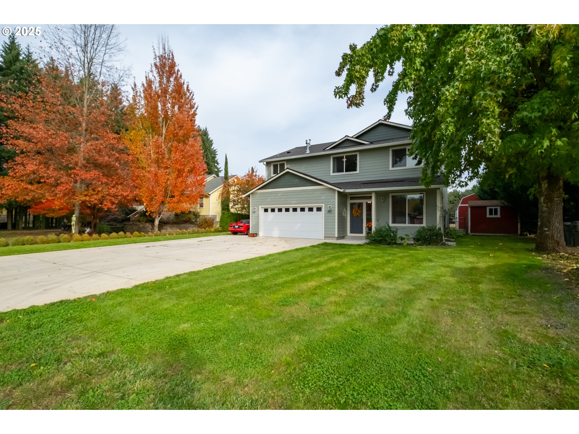 405 Northwest Juniper Lane Albany, OR 97321 - Photo 1 of 48 a view of a white house with a big yard and large trees