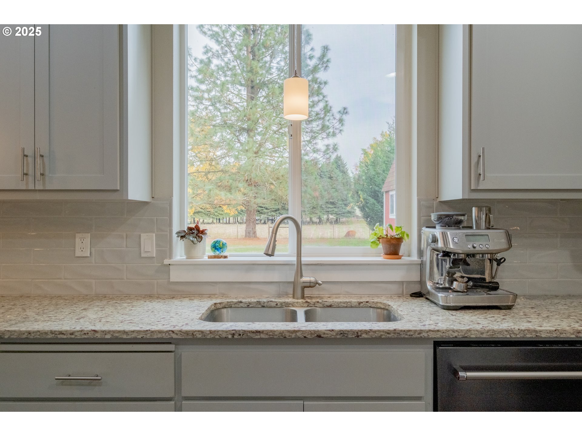 405 Northwest Juniper Lane Albany, OR 97321 - Photo 12 of 48 a kitchen with granite countertop a sink and a window
