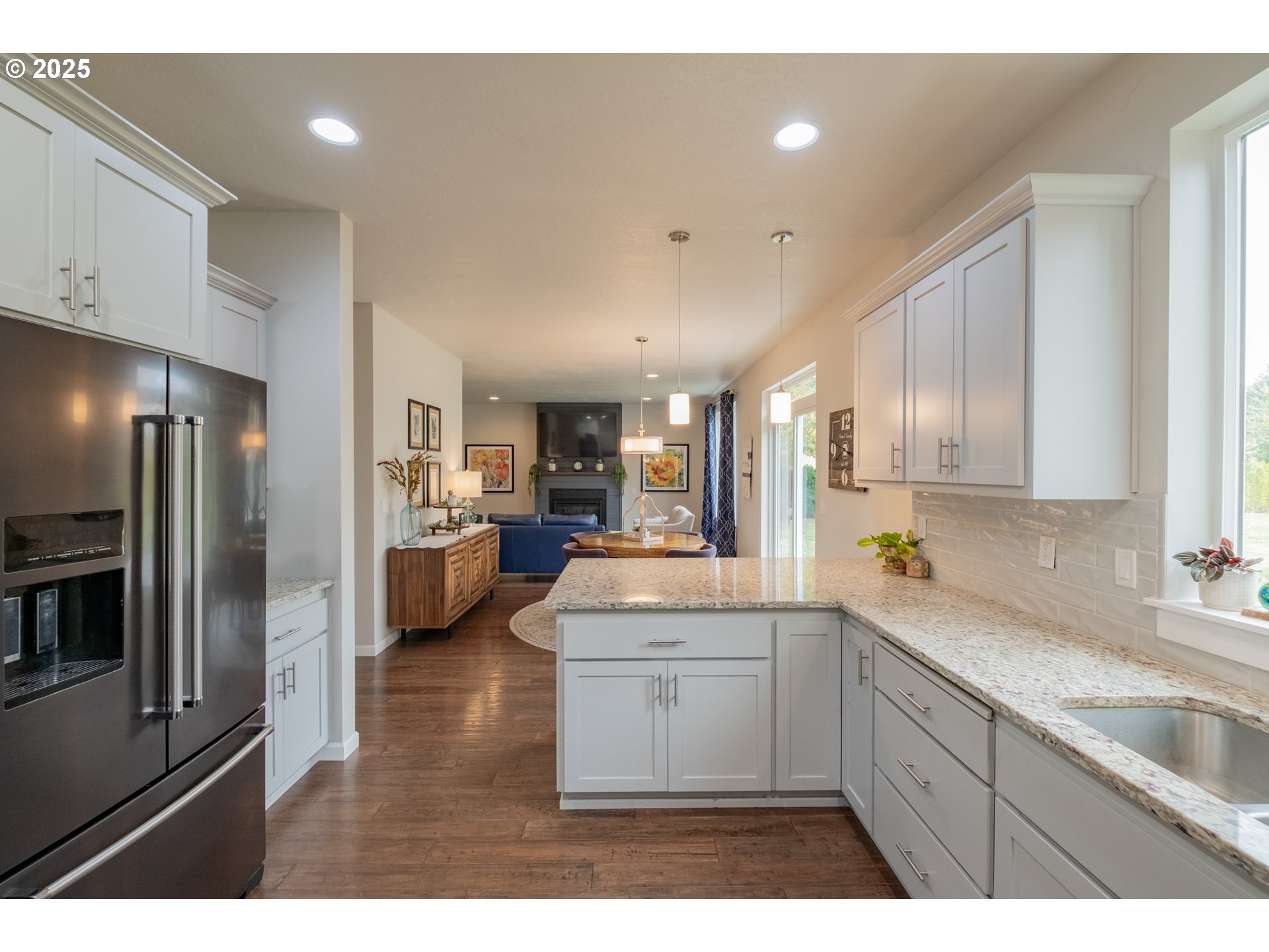 405 Northwest Juniper Lane Albany, OR 97321 - Photo 13 of 48 a kitchen with a sink stainless steel appliances and cabinets