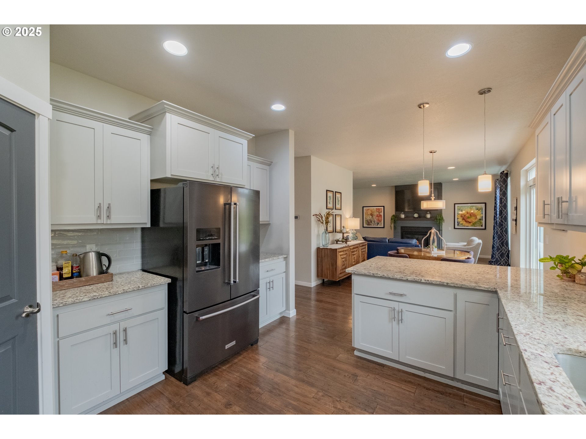 405 Northwest Juniper Lane Albany, OR 97321 - Photo 14 of 48 a kitchen with stainless steel appliances kitchen island a refrigerator sink and cabinets