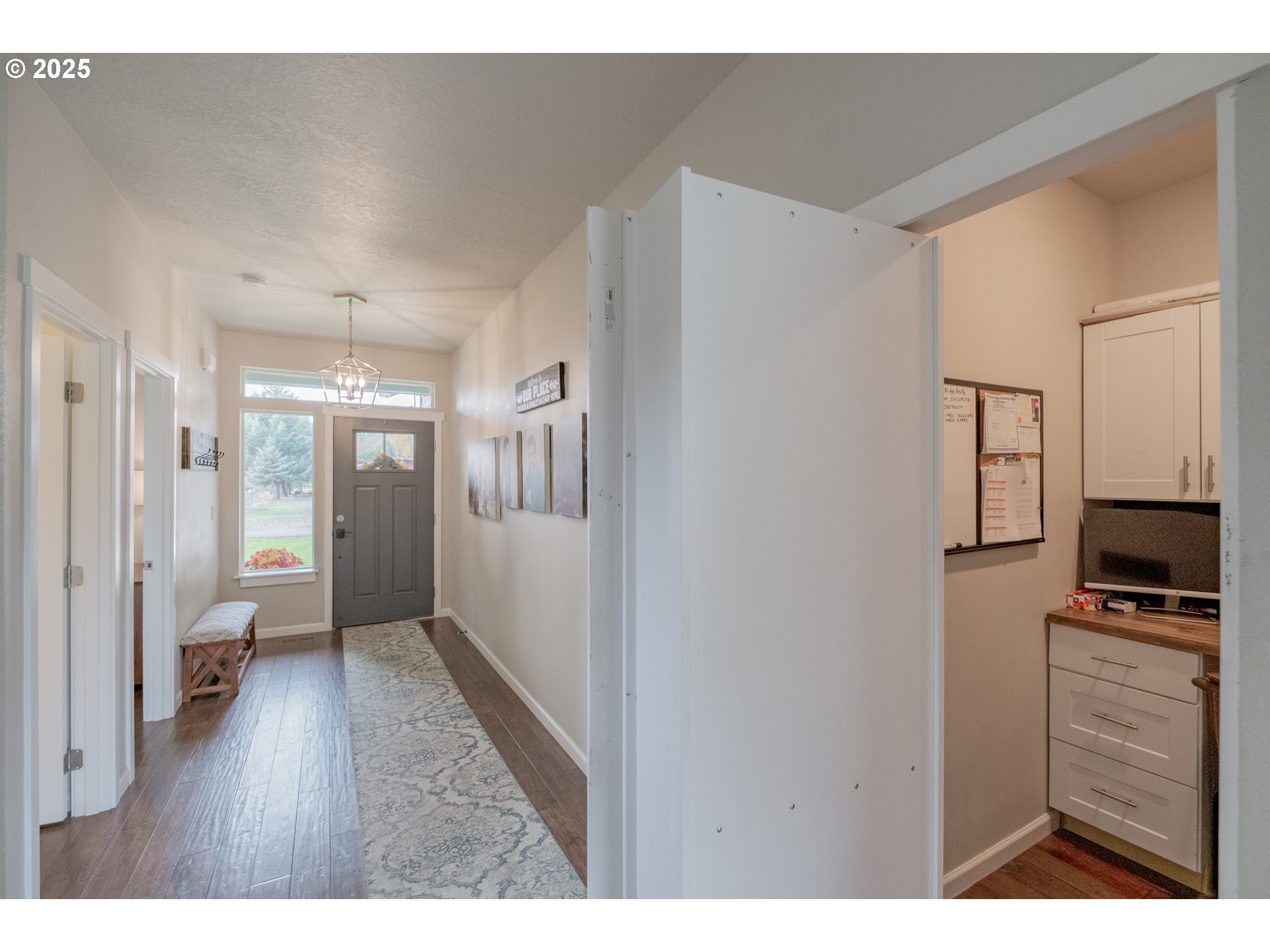 405 Northwest Juniper Lane Albany, OR 97321 - Photo 17 of 48 a view of a hallway with bathroom and wooden floor