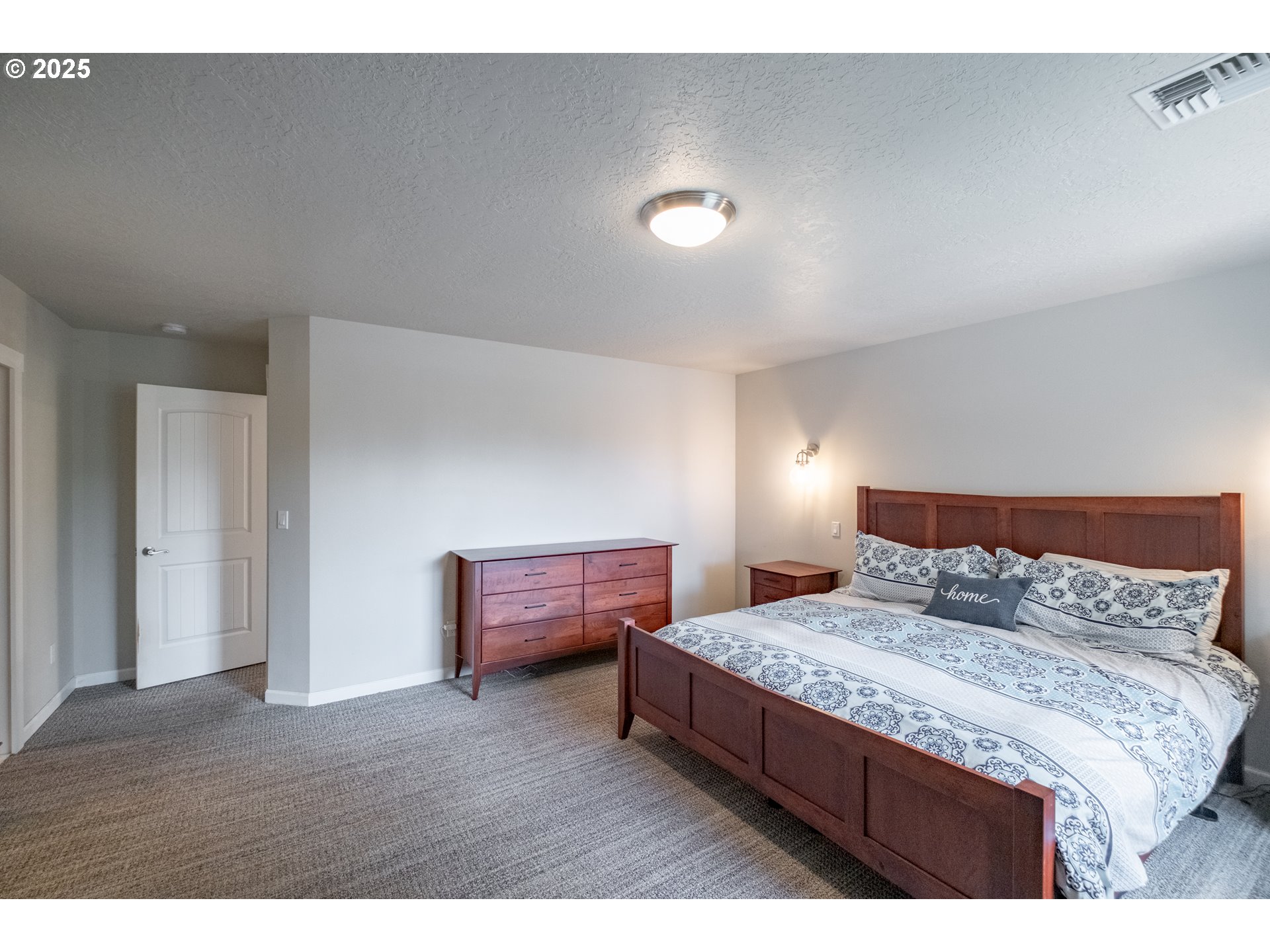 405 Northwest Juniper Lane Albany, OR 97321 - Photo 25 of 48 a bedroom with a bed and a night stand