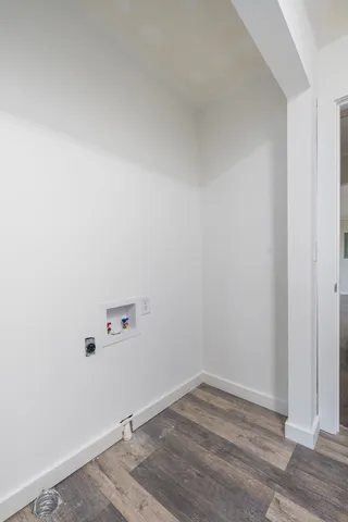 a view of a small space with wooden floor