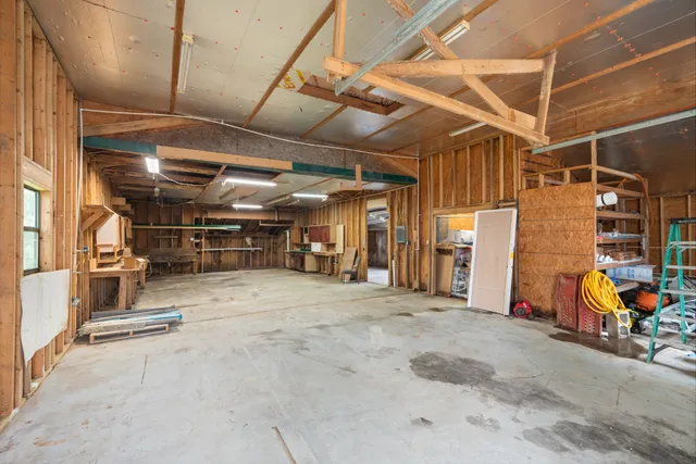 a view of empty room with wooden ceiling