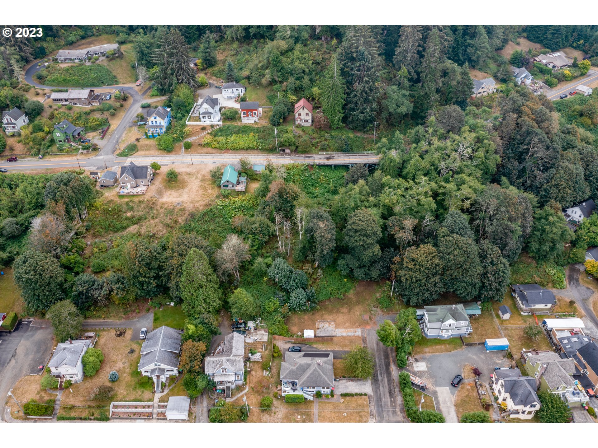 836 33rd Street Astoria, OR 97103 - Photo 10 of 11 an aerial view of residential houses with outdoor space and trees