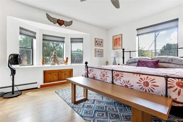 a living room with furniture stairs and a window