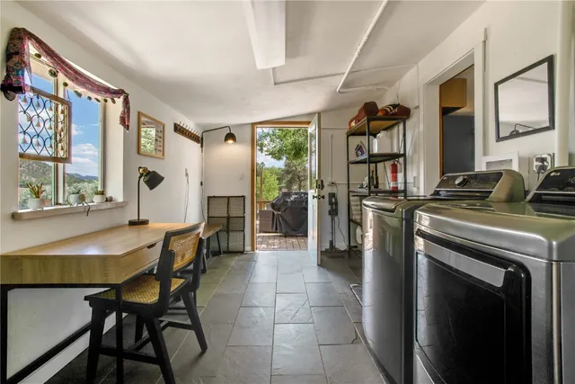a dining room with furniture and window