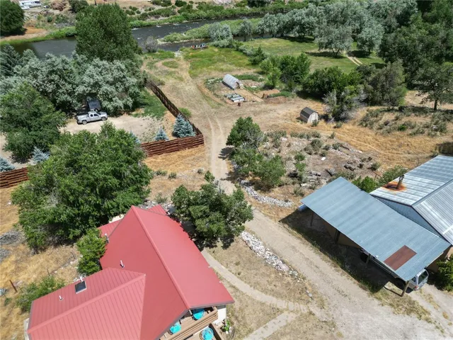 an aerial view of a house with a yard