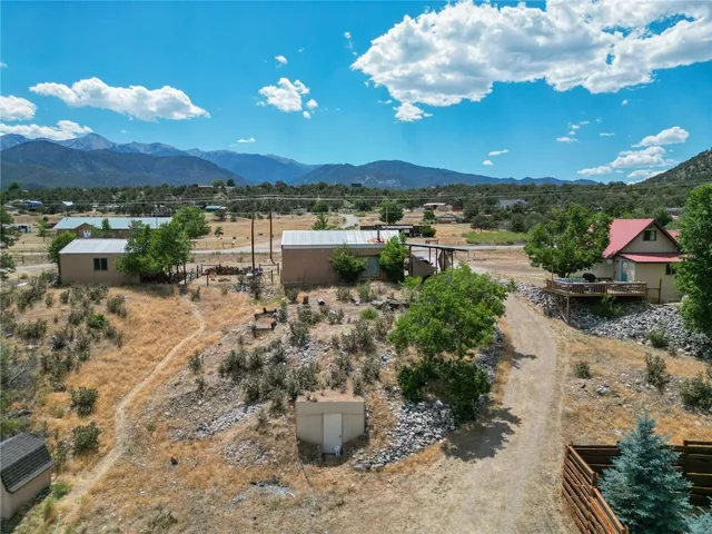 a view of a lake with lawn chairs