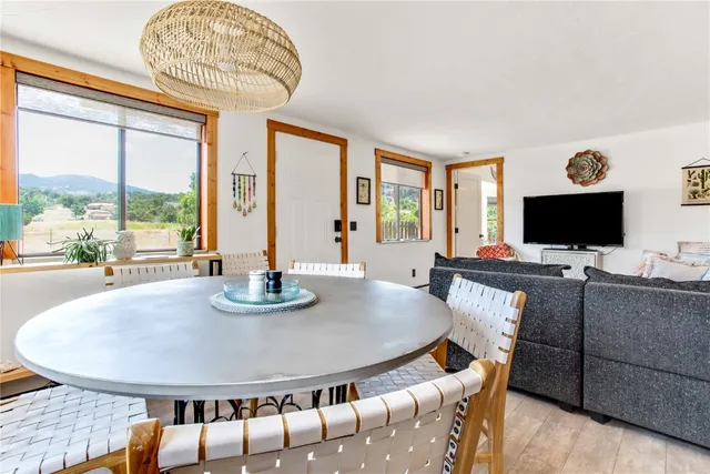 a view of a dining room with furniture window and outside view