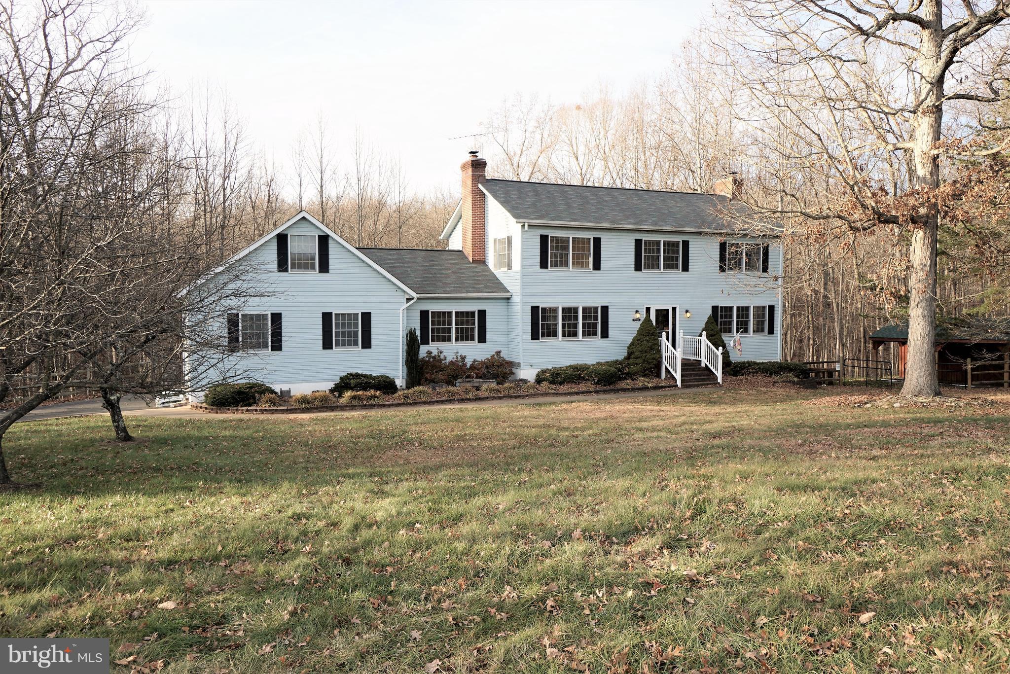 5940 Free State Road Marshall, VA 20115 - Photo 2 of 30 a view of a yard in front of a house with large trees