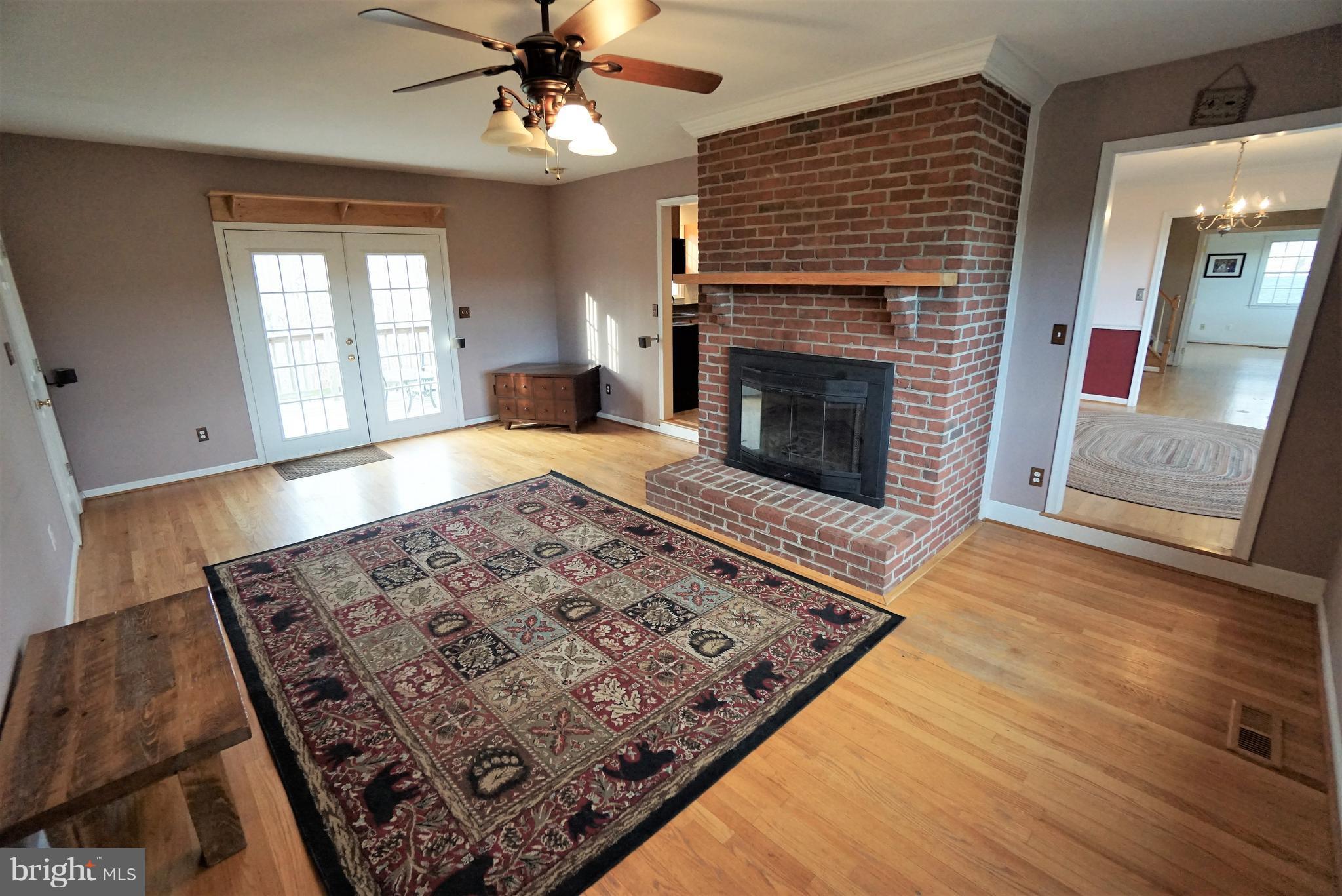 5940 Free State Road Marshall, VA 20115 - Photo 11 of 30 a living room with a rug fireplace and a wooden floor
