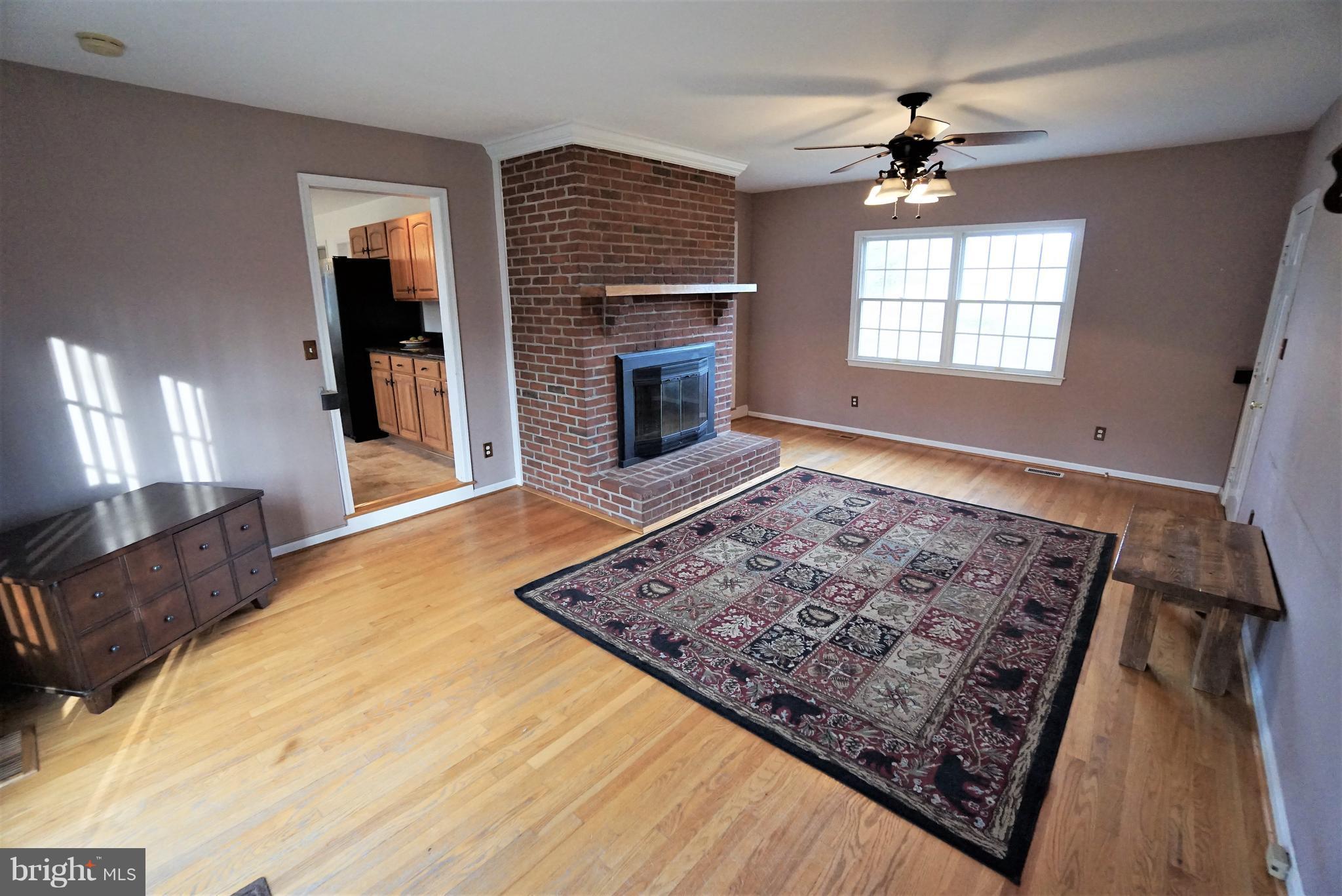 5940 Free State Road Marshall, VA 20115 - Photo 12 of 30 a spacious bedroom with a bed and a fireplace