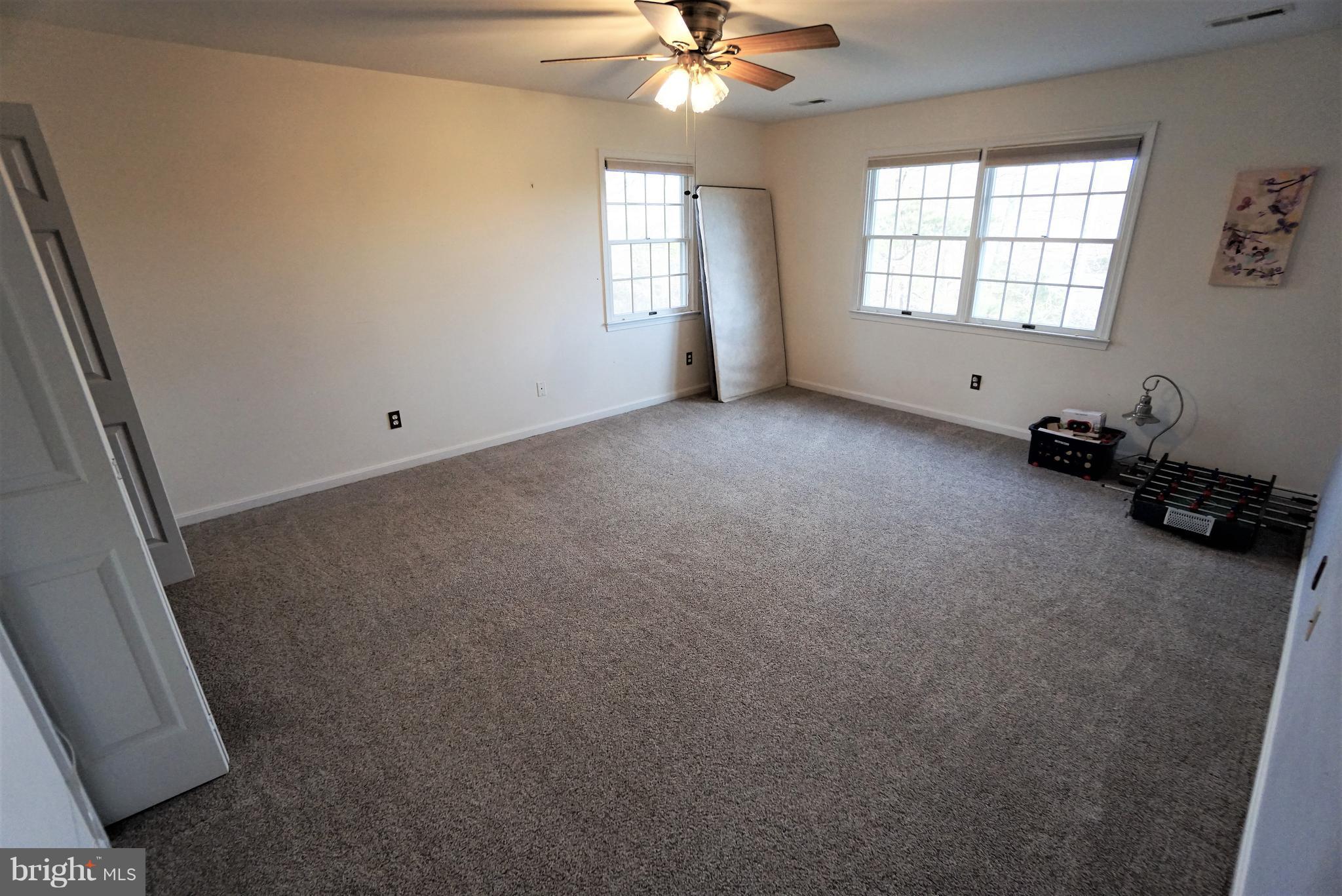 5940 Free State Road Marshall, VA 20115 - Photo 14 of 30 an empty room with windows and fan