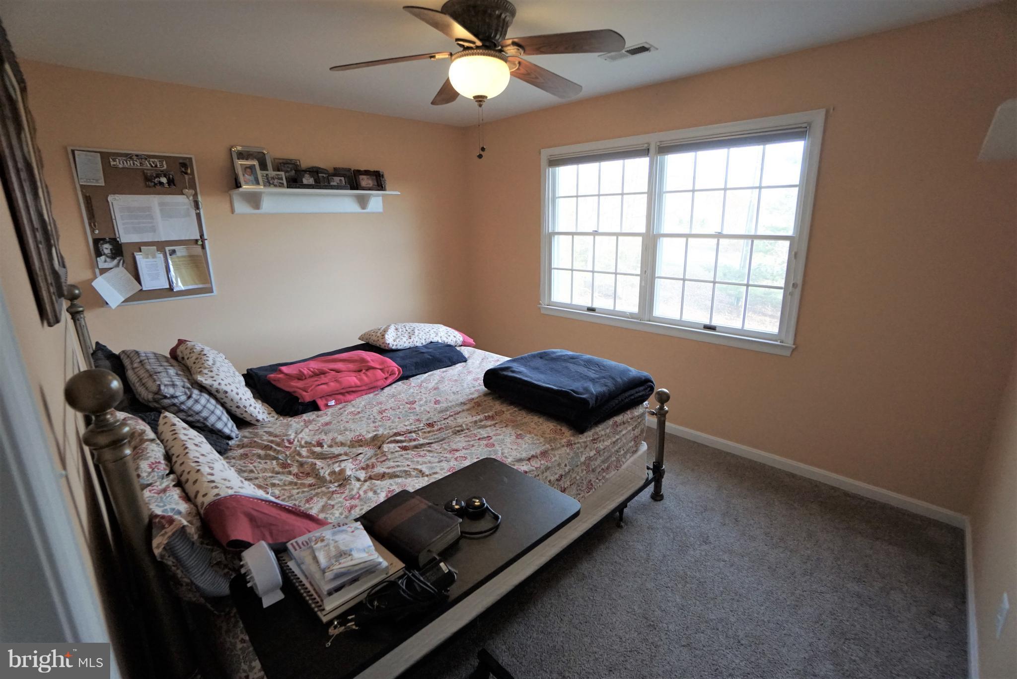 5940 Free State Road Marshall, VA 20115 - Photo 17 of 30 a bed sitting in a bedroom next to a window