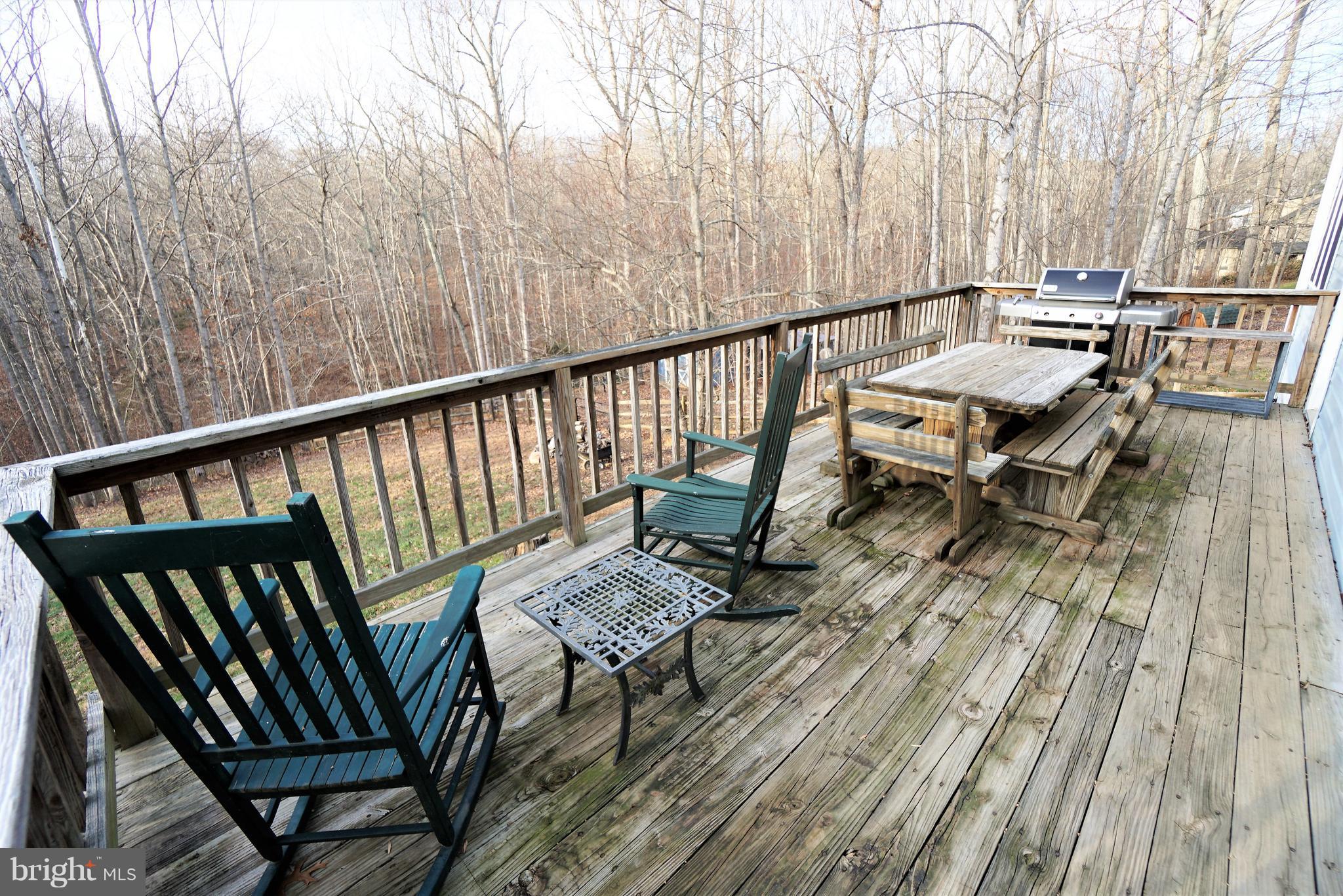 5940 Free State Road Marshall, VA 20115 - Photo 24 of 30 a view of balcony with wooden floor and outdoor seating