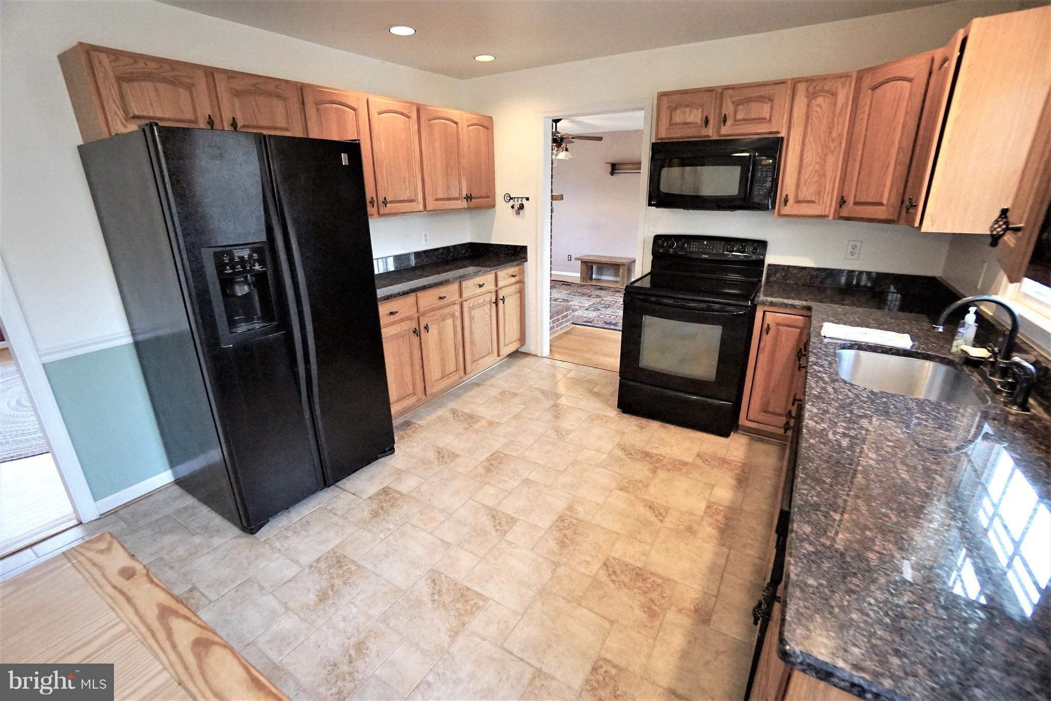 5940 Free State Road Marshall, VA 20115 - Photo 9 of 30 a kitchen with stainless steel appliances a refrigerator stove microwave and sink