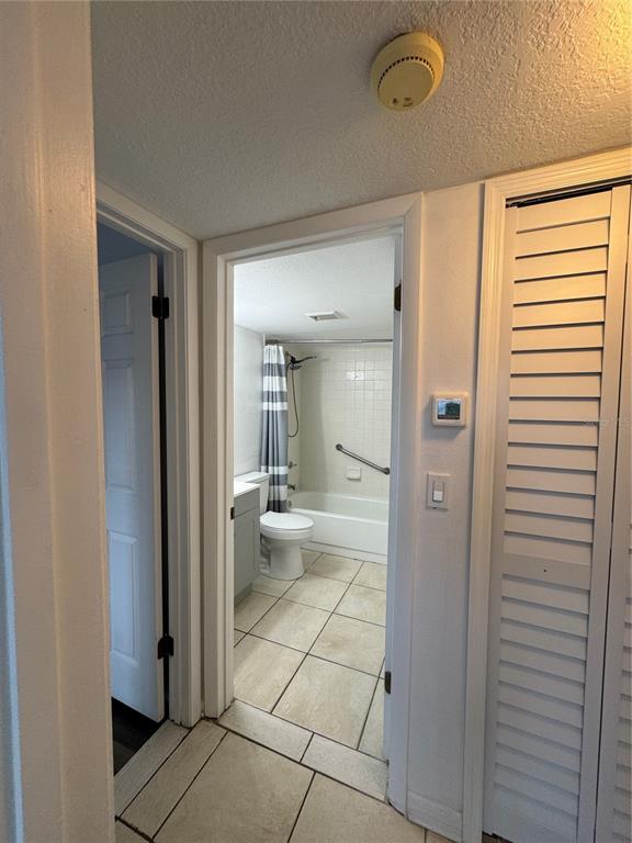 8213 Sun Spring Circle, Unit 61 Orlando, FL 32825 - Photo 19 of 44 a bathroom with a glass door shower a sink and a mirror