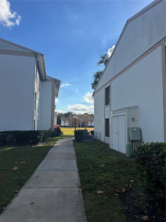 8213 Sun Spring Circle, Unit 61 Orlando, FL 32825 - Photo 2 of 44 a view of back yard of the house