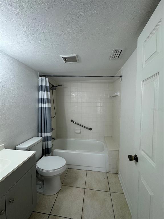 8213 Sun Spring Circle, Unit 61 Orlando, FL 32825 - Photo 27 of 44 a bathroom with a toilet a sink and bathtub