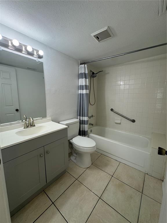8213 Sun Spring Circle, Unit 61 Orlando, FL 32825 - Photo 28 of 44 a bathroom with a sink toilet and shower