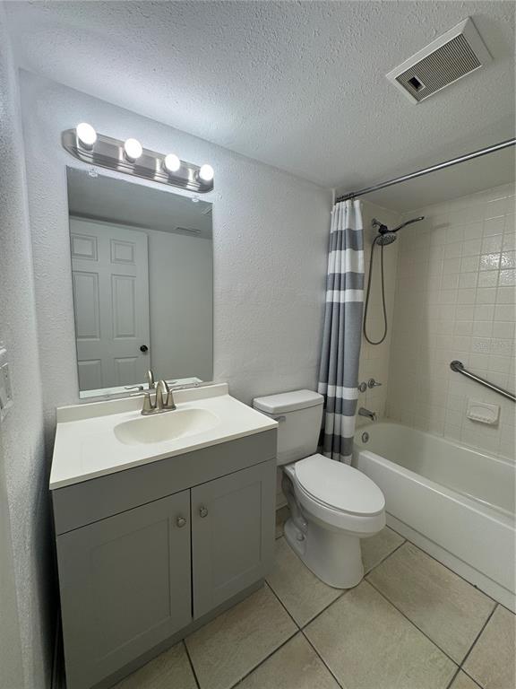 8213 Sun Spring Circle, Unit 61 Orlando, FL 32825 - Photo 30 of 44 a bathroom with a double vanity sink mirror and toilet
