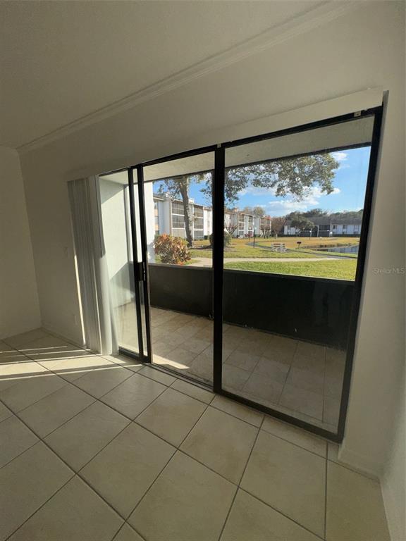 8213 Sun Spring Circle, Unit 61 Orlando, FL 32825 - Photo 35 of 44 a view of an empty room with a window