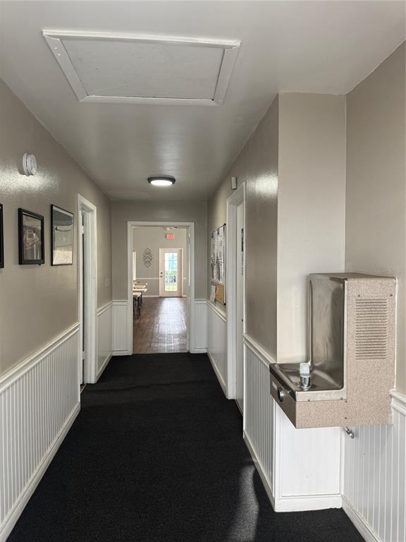8213 Sun Spring Circle, Unit 61 Orlando, FL 32825 - Photo 38 of 44 a view of a hallway with wooden floor and staircase