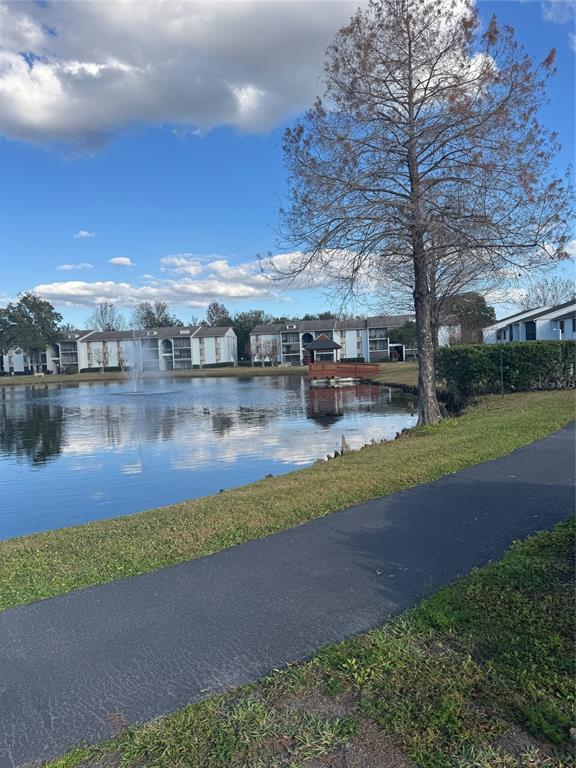 8213 Sun Spring Circle, Unit 61 Orlando, FL 32825 - Photo 41 of 44 a view of a lake with houses