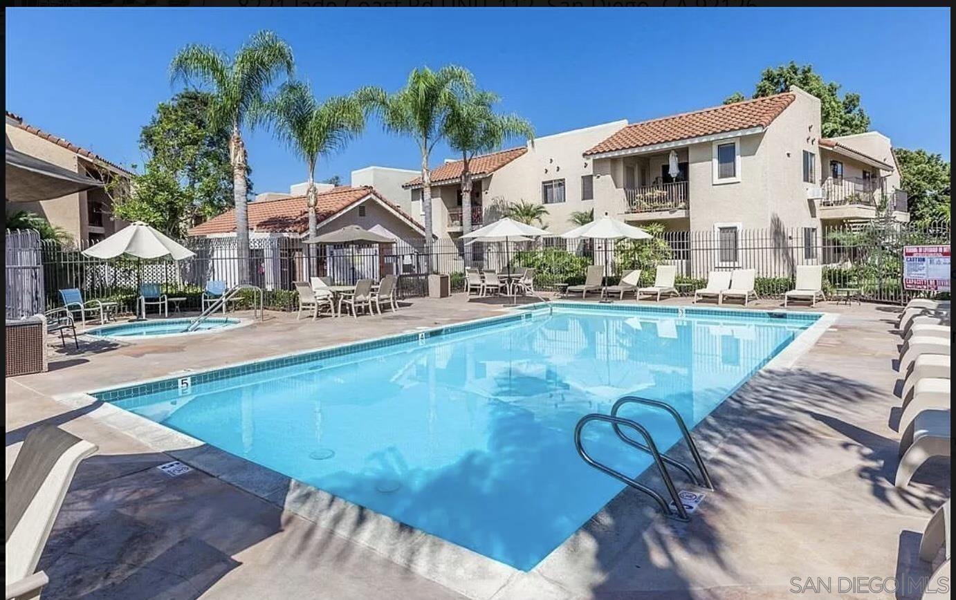 8221 Jade Coast Road, Unit 111 San Diego, CA 92126 - Photo 1 of 29 a view of a house with swimming pool
