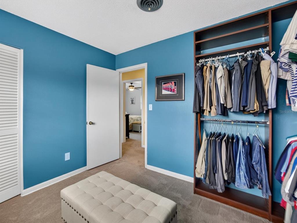 2803 Banchory Road Winter Park, FL 32792 - Photo 20 of 31 a view of walk in closet with clothes and shoes