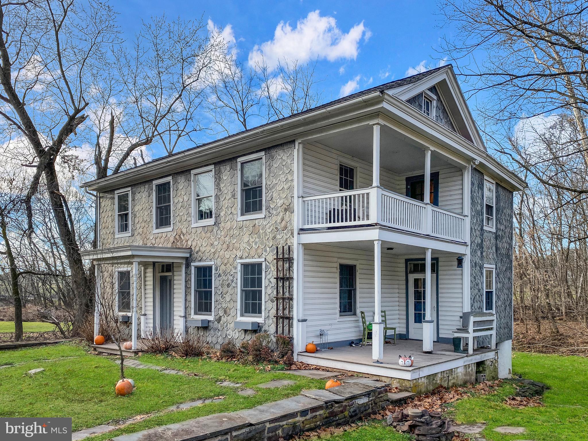 589 Groffs Mill Road Harleysville, PA 19438 - Photo 1 of 14 front view of a house with a yard