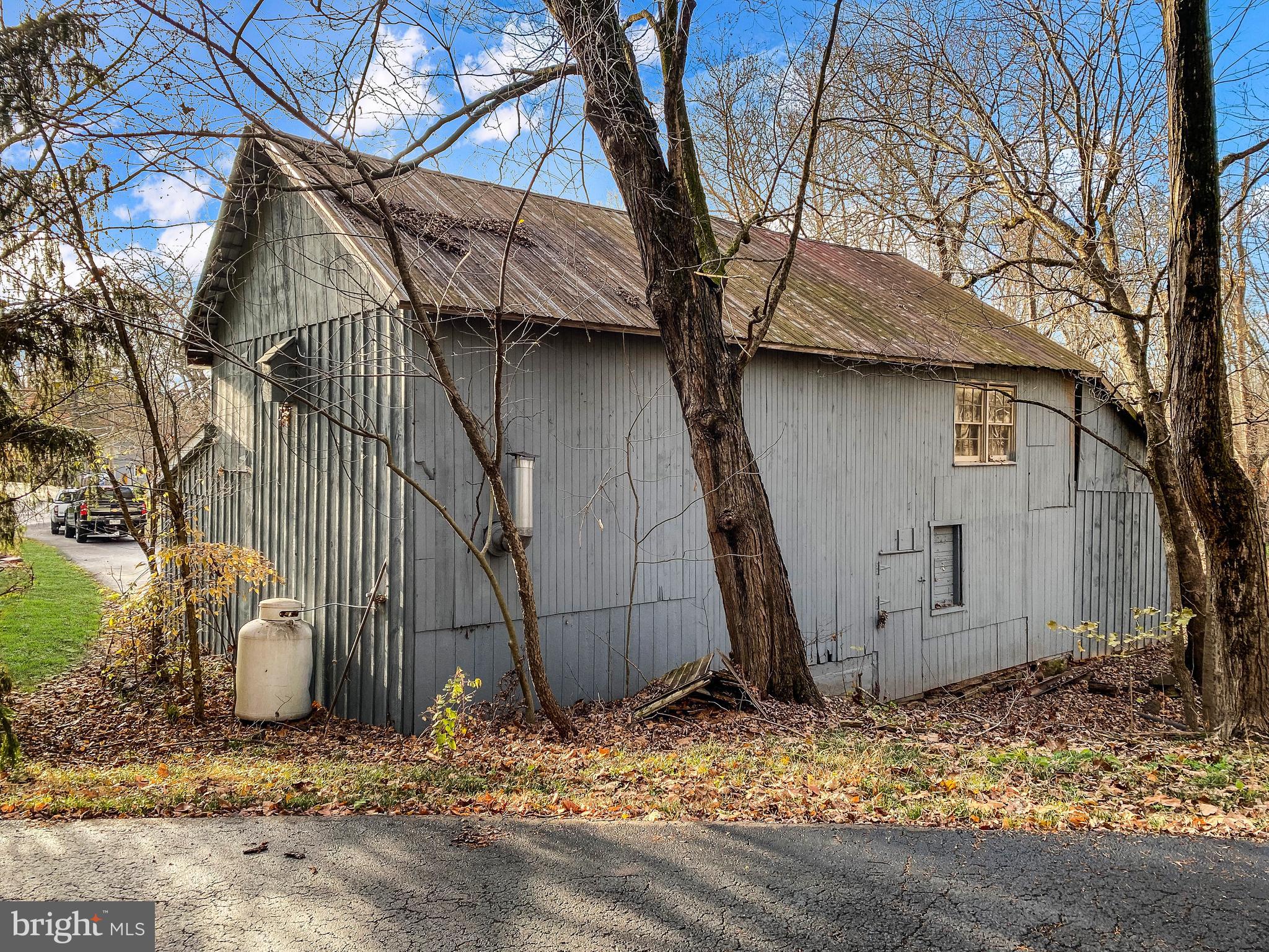 589 Groffs Mill Road Harleysville, PA 19438 - Photo 11 of 14 a tree in front of a house