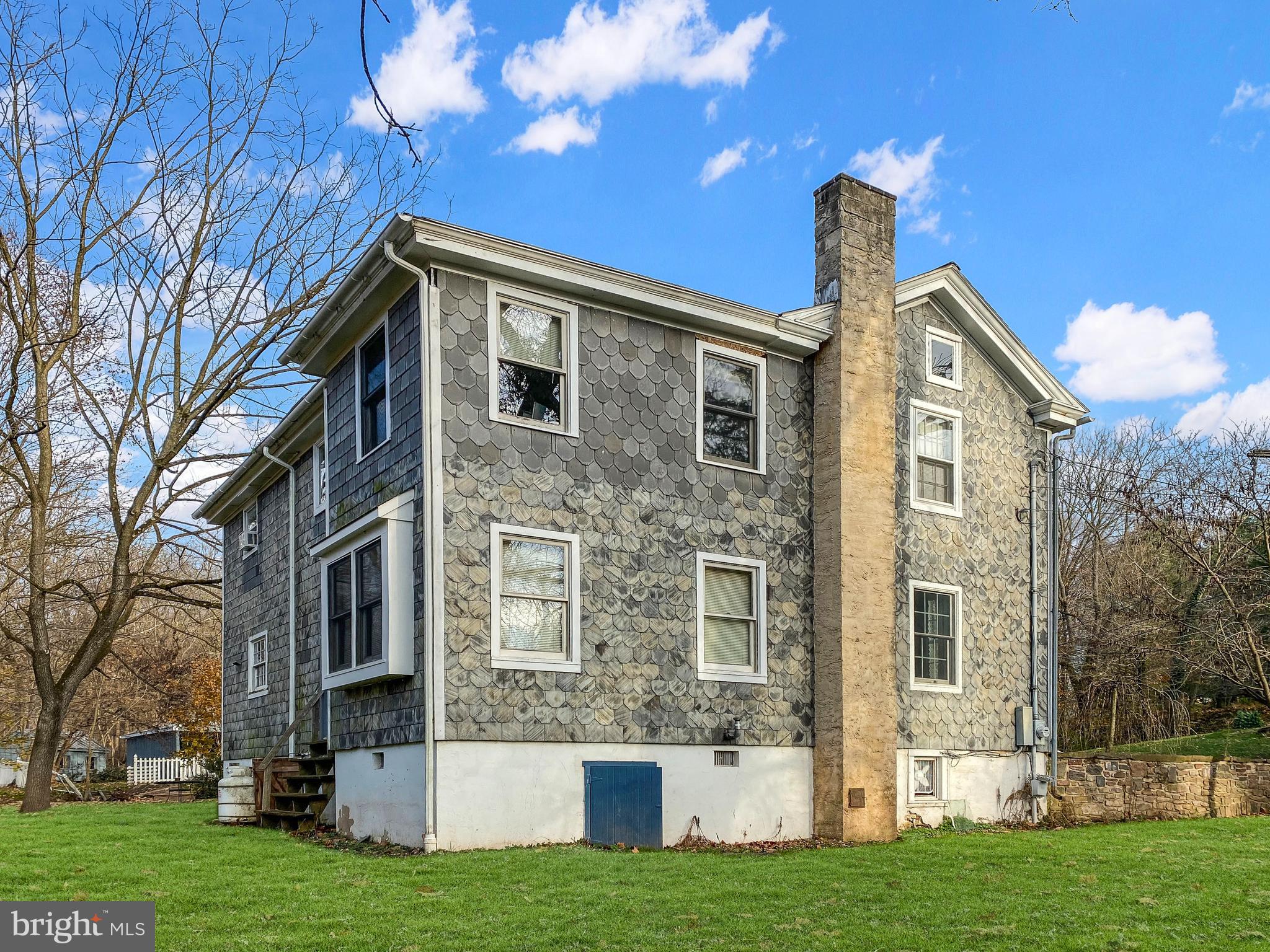 589 Groffs Mill Road Harleysville, PA 19438 - Photo 4 of 14 a front view of a house with a yard