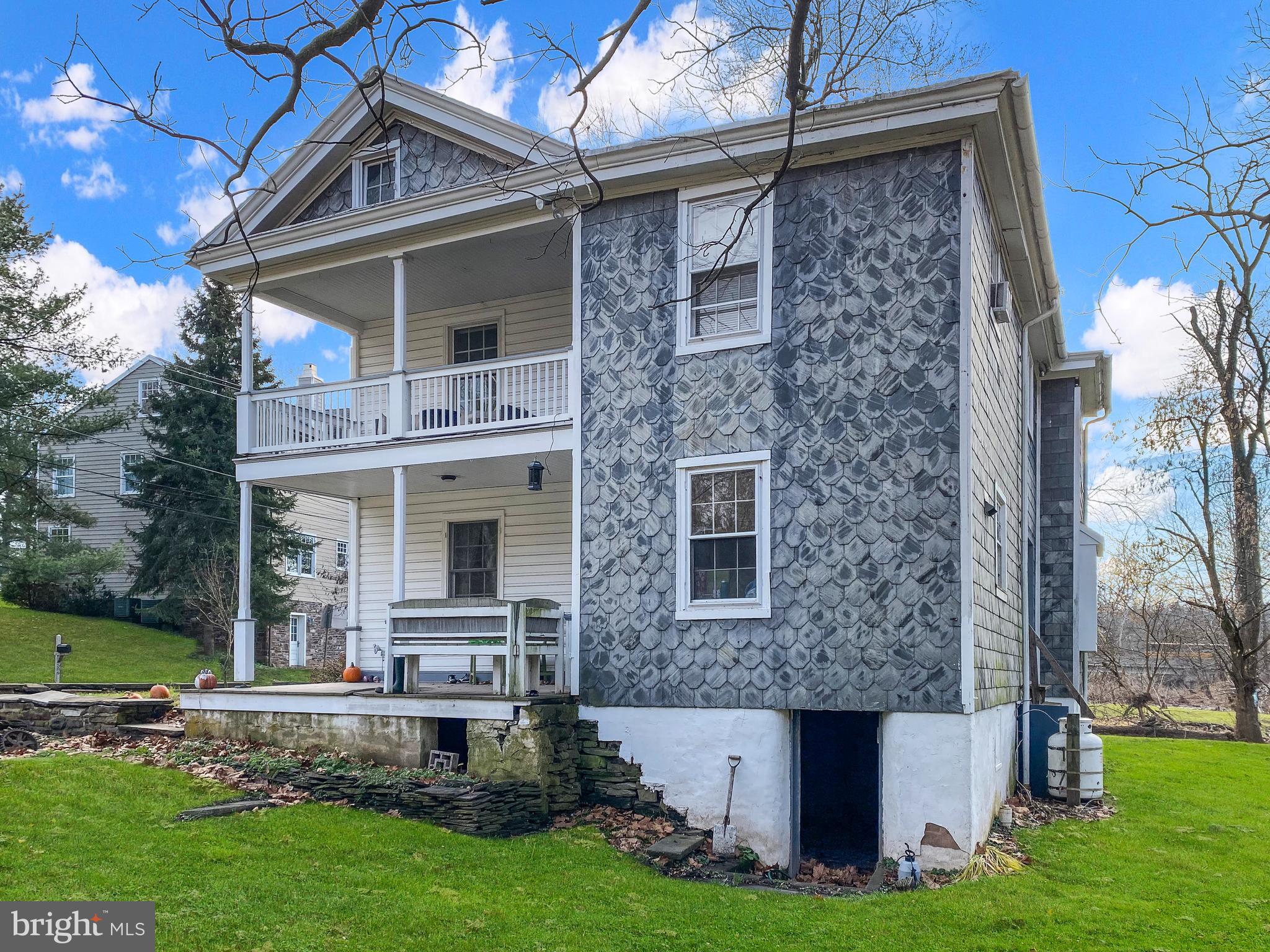 589 Groffs Mill Road Harleysville, PA 19438 - Photo 5 of 14 a front view of a house with garden
