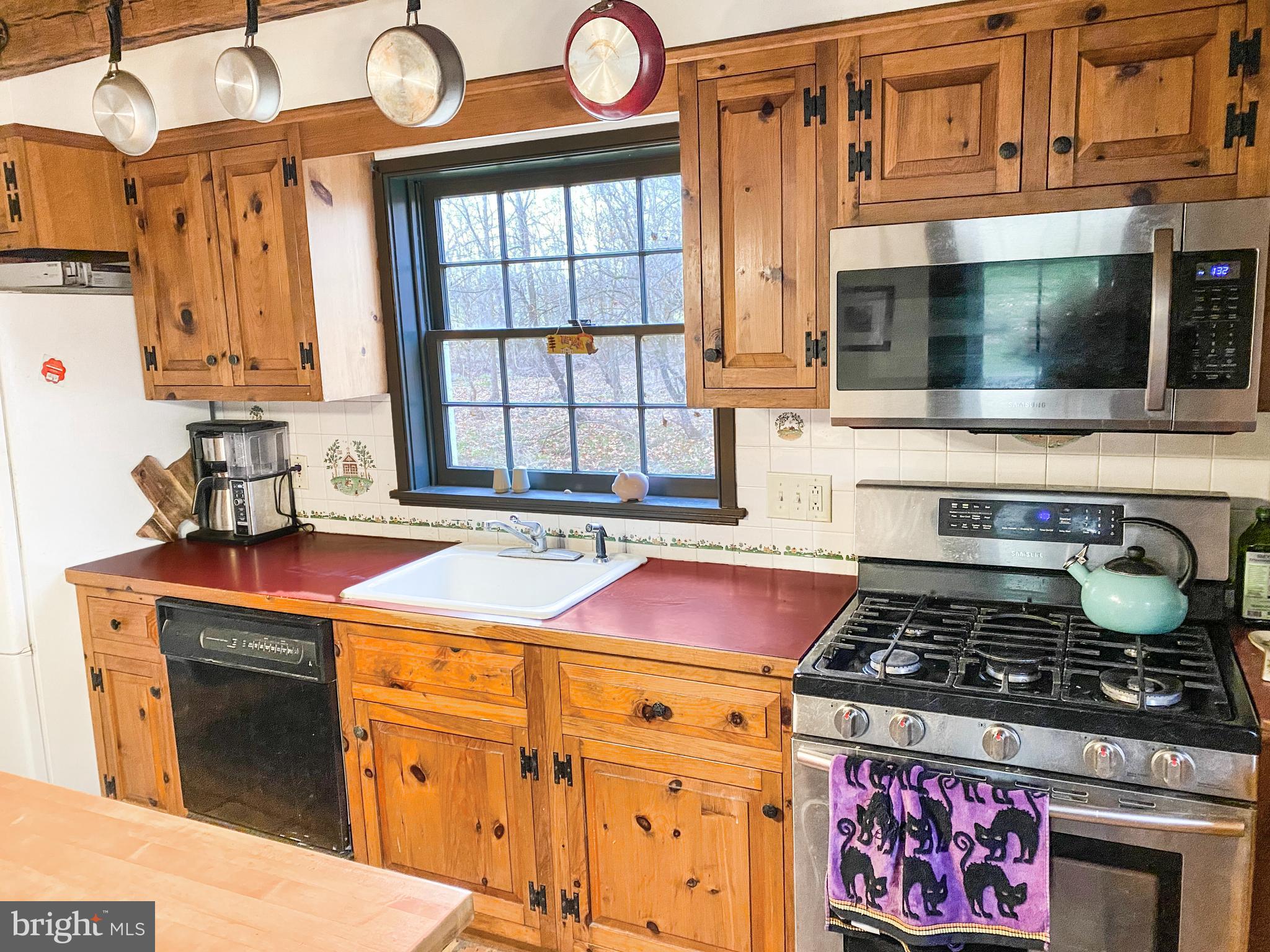 589 Groffs Mill Road Harleysville, PA 19438 - Photo 8 of 14 a kitchen with stainless steel appliances granite countertop a stove and a sink