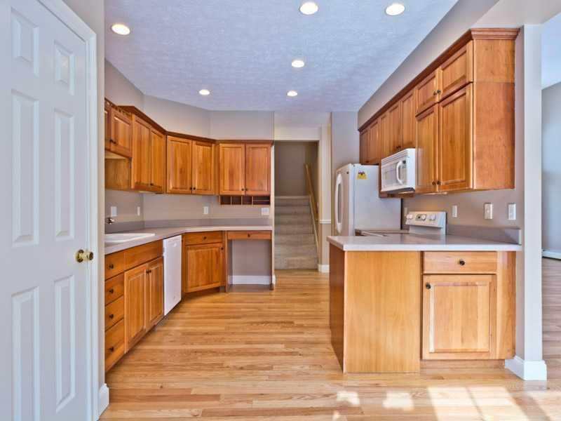 23 Rock Ridge Run Cumberland Center, ME 04021 - Photo 11 of 35 Kitchen. Gleaming hardwood...