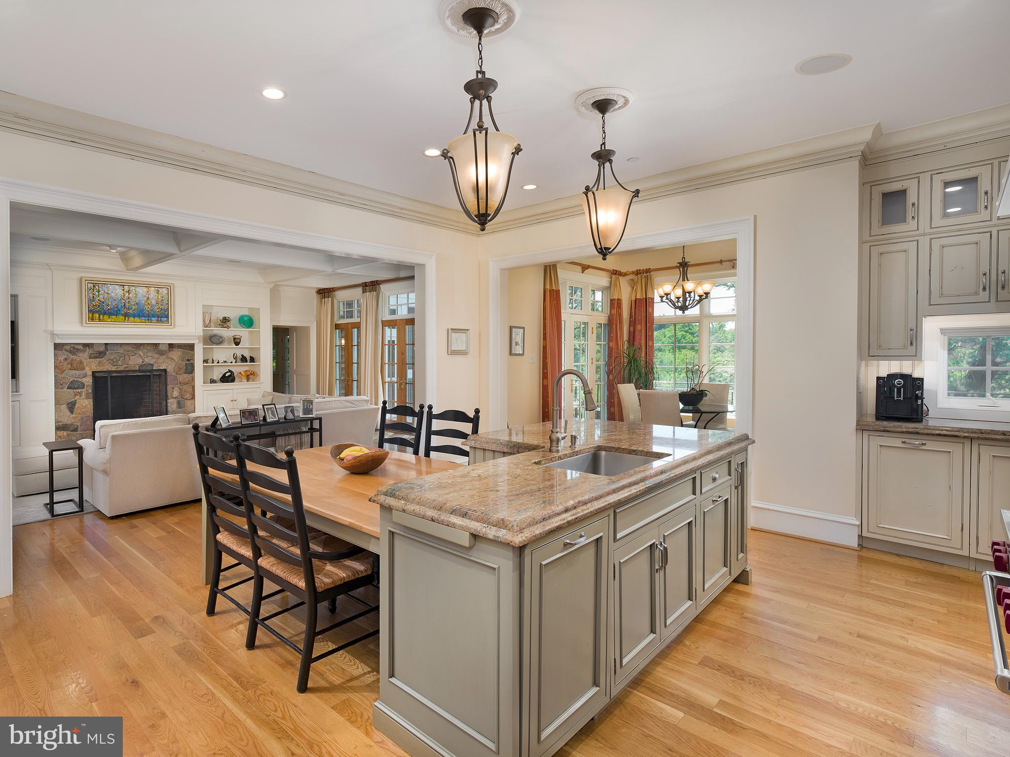 102 Springhouse Lane Newtown Square, PA 19073 - Photo 20 of 80 a kitchen that has a table chairs in it and wooden floors