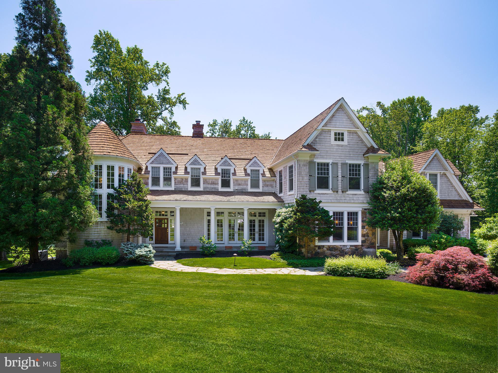 102 Springhouse Lane Newtown Square, PA 19073 - Photo 3 of 80 a front view of a house with a garden and yard