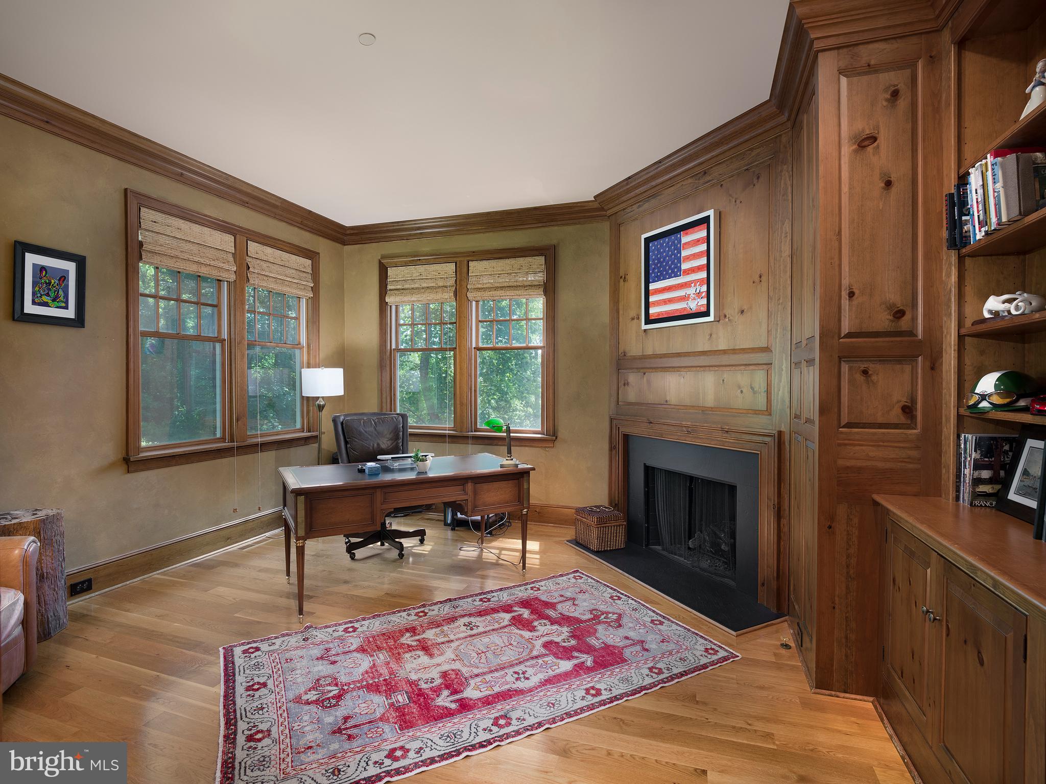 102 Springhouse Lane Newtown Square, PA 19073 - Photo 38 of 80 a living room with furniture a rug and a fireplace