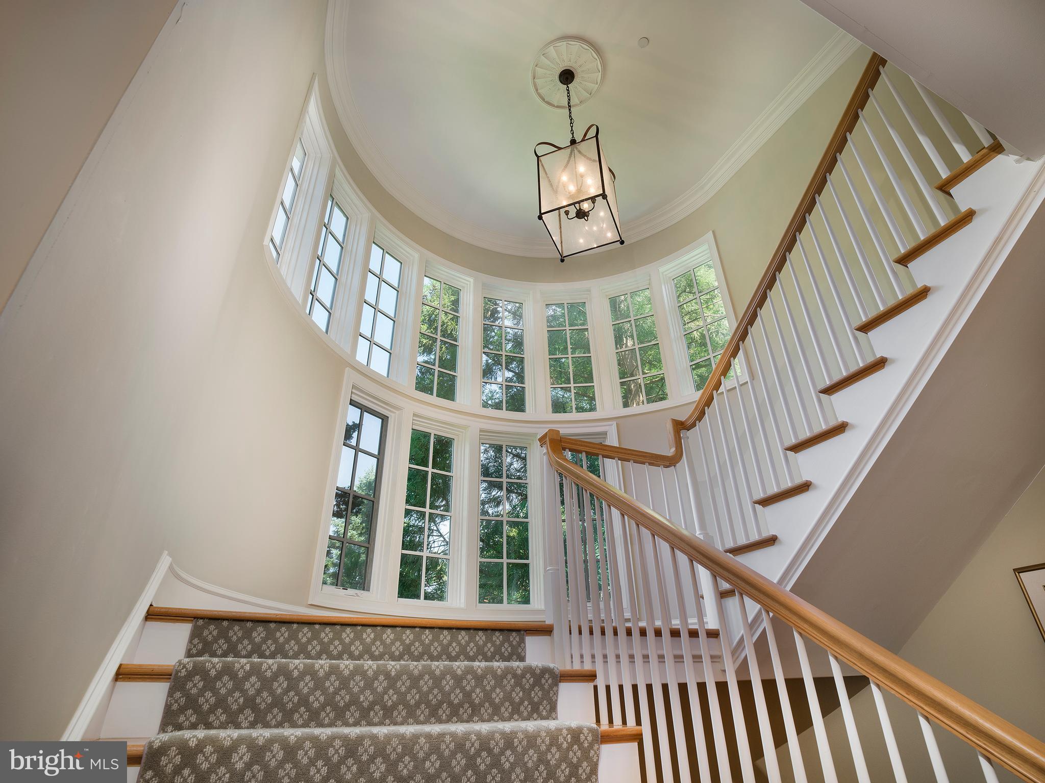 102 Springhouse Lane Newtown Square, PA 19073 - Photo 40 of 80 a view of staircase with railing and a chandelier