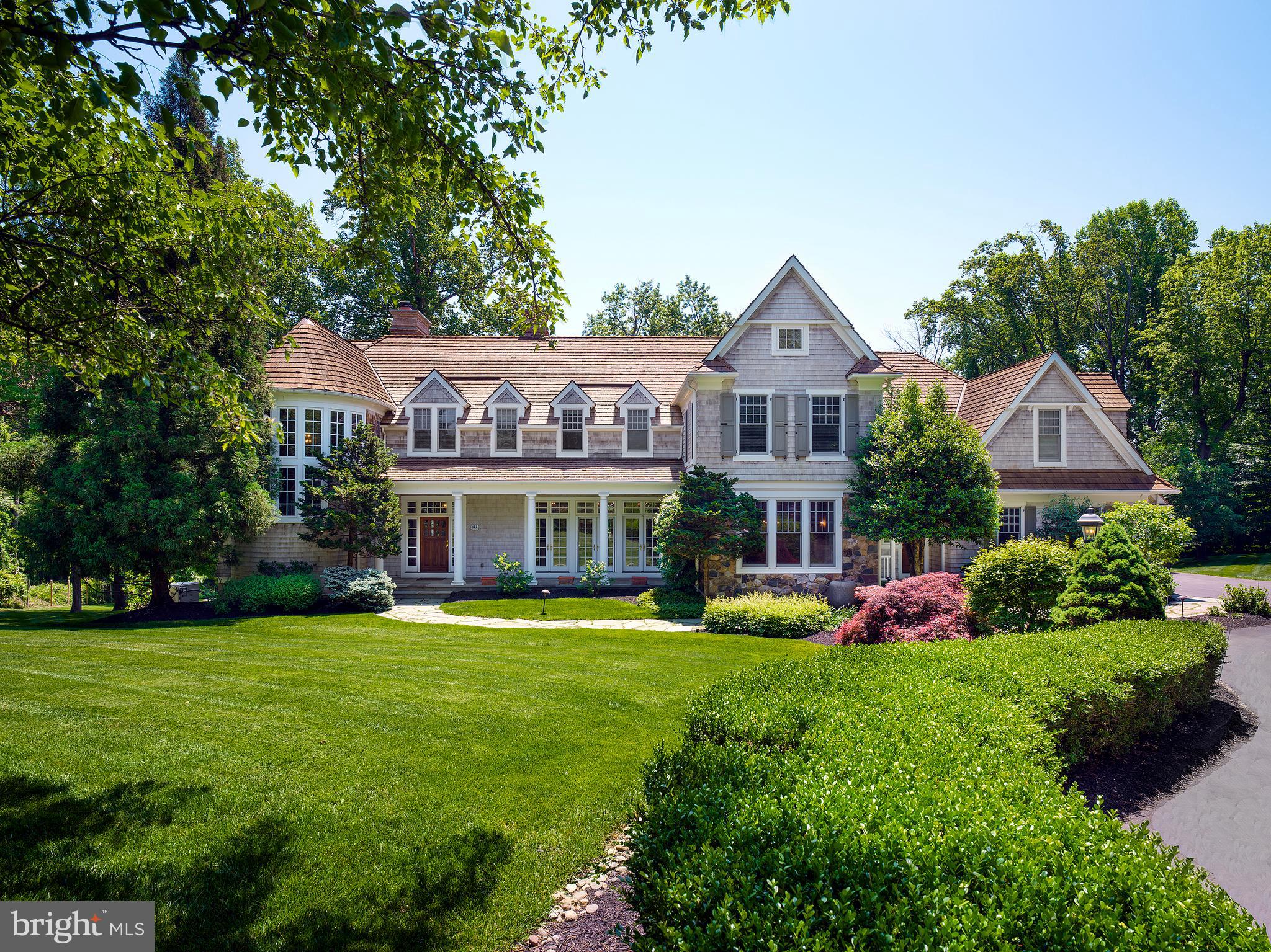 102 Springhouse Lane Newtown Square, PA 19073 - Photo 4 of 80 a front view of a house with garden and trees