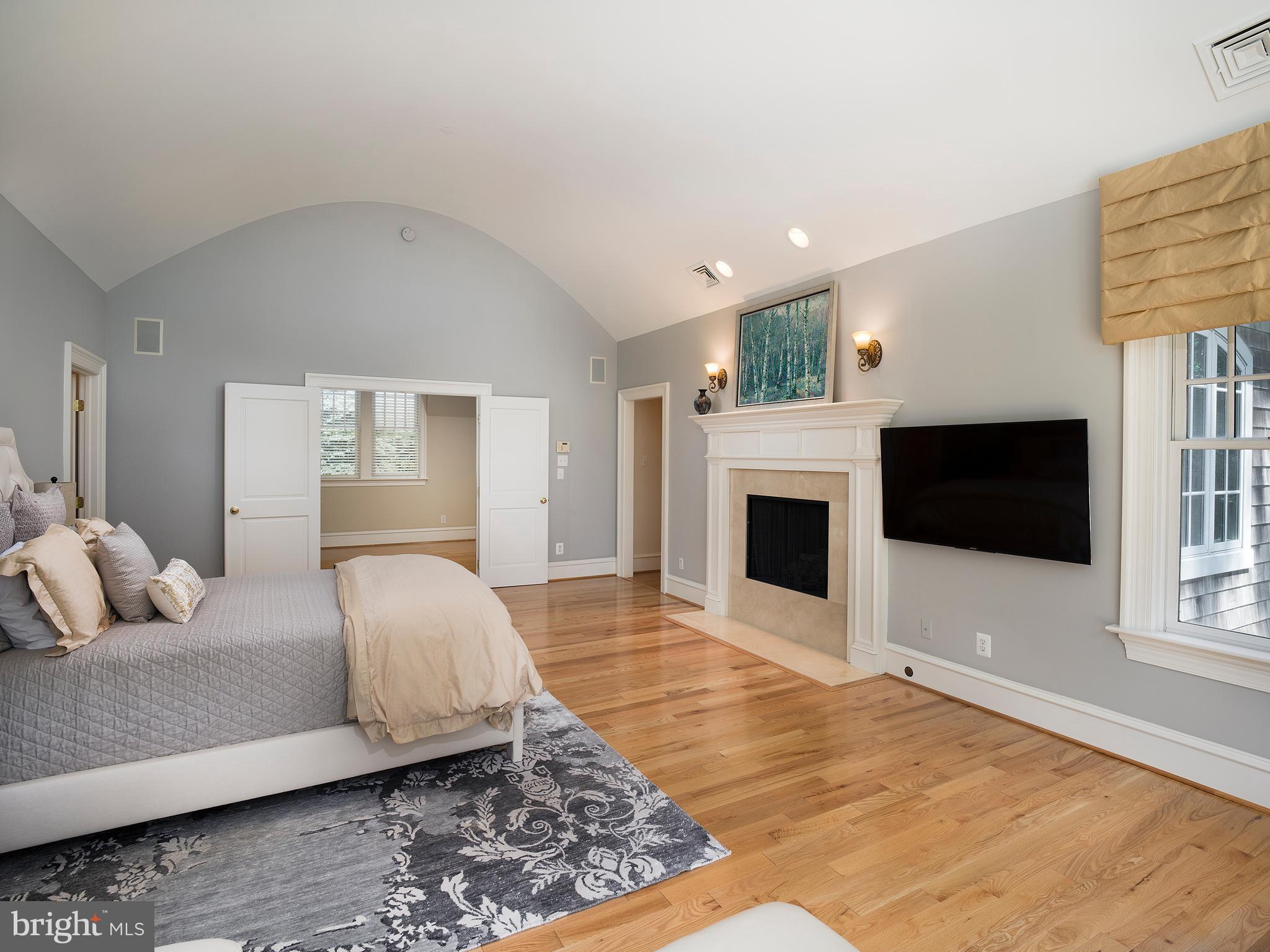 102 Springhouse Lane Newtown Square, PA 19073 - Photo 45 of 80 a bedroom with a bed and a flat screen tv