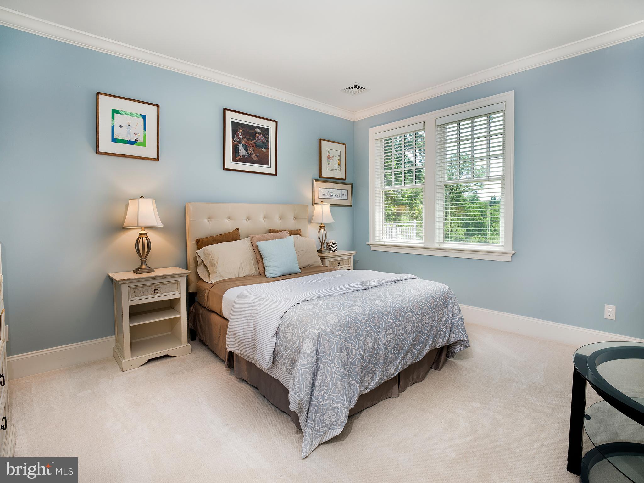 102 Springhouse Lane Newtown Square, PA 19073 - Photo 53 of 80 a bed sitting in a bedroom next to a window