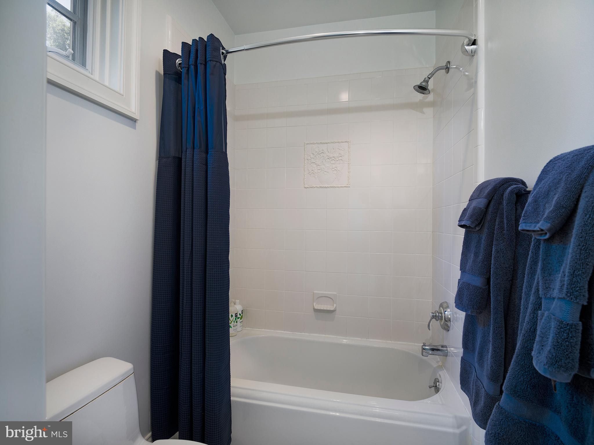 102 Springhouse Lane Newtown Square, PA 19073 - Photo 58 of 80 a bathroom with a shower and a toilet