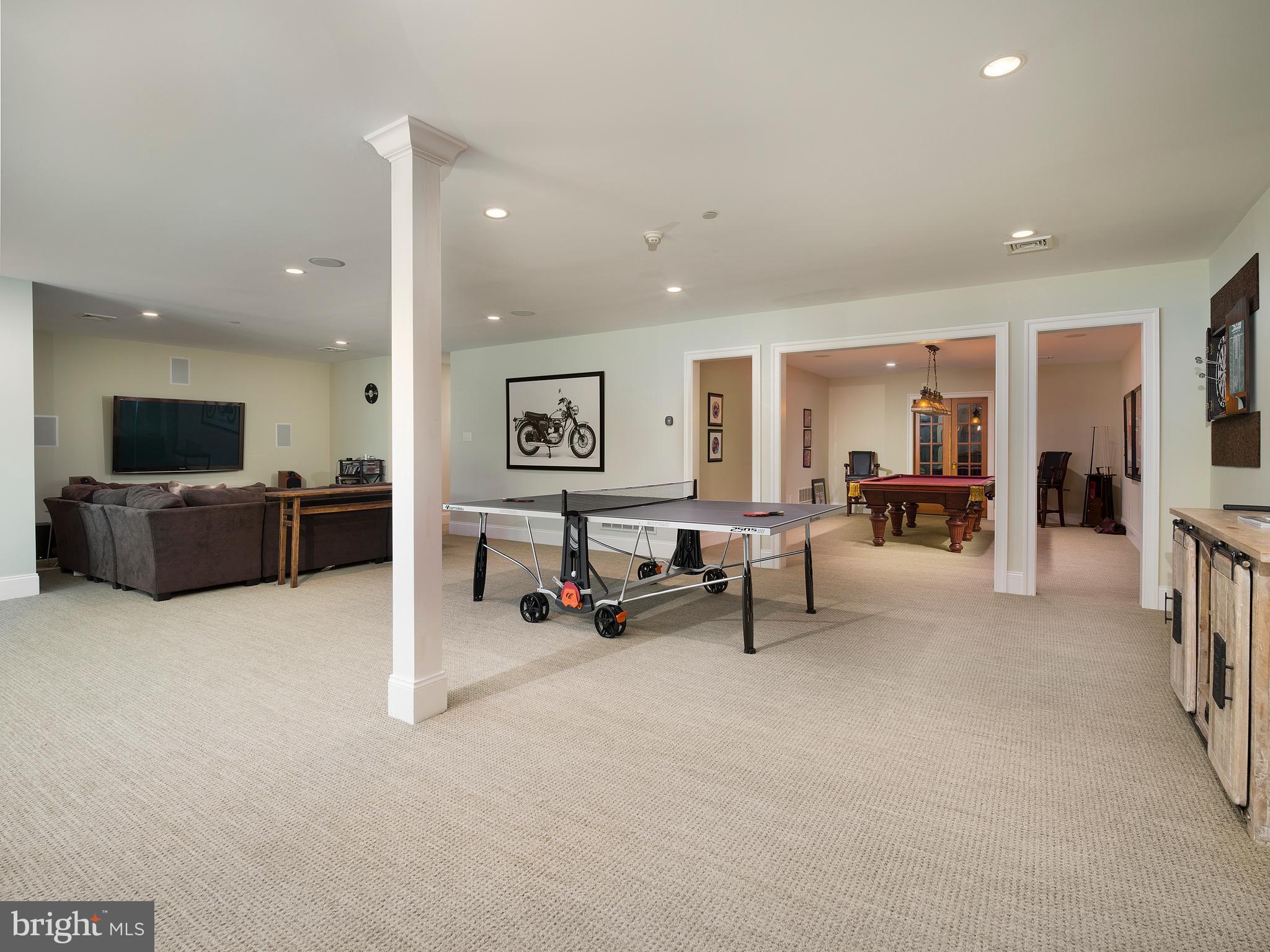 102 Springhouse Lane Newtown Square, PA 19073 - Photo 62 of 80 a living room with furniture and a flat screen tv