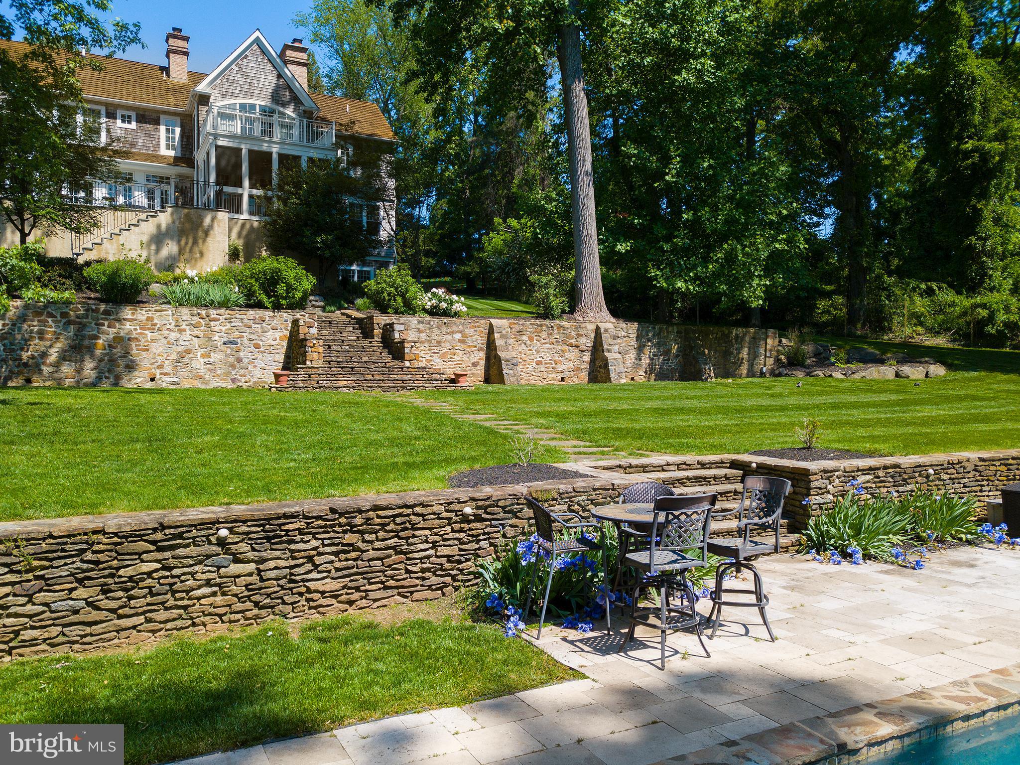 102 Springhouse Lane Newtown Square, PA 19073 - Photo 72 of 80 a view of a house with backyard and sitting area