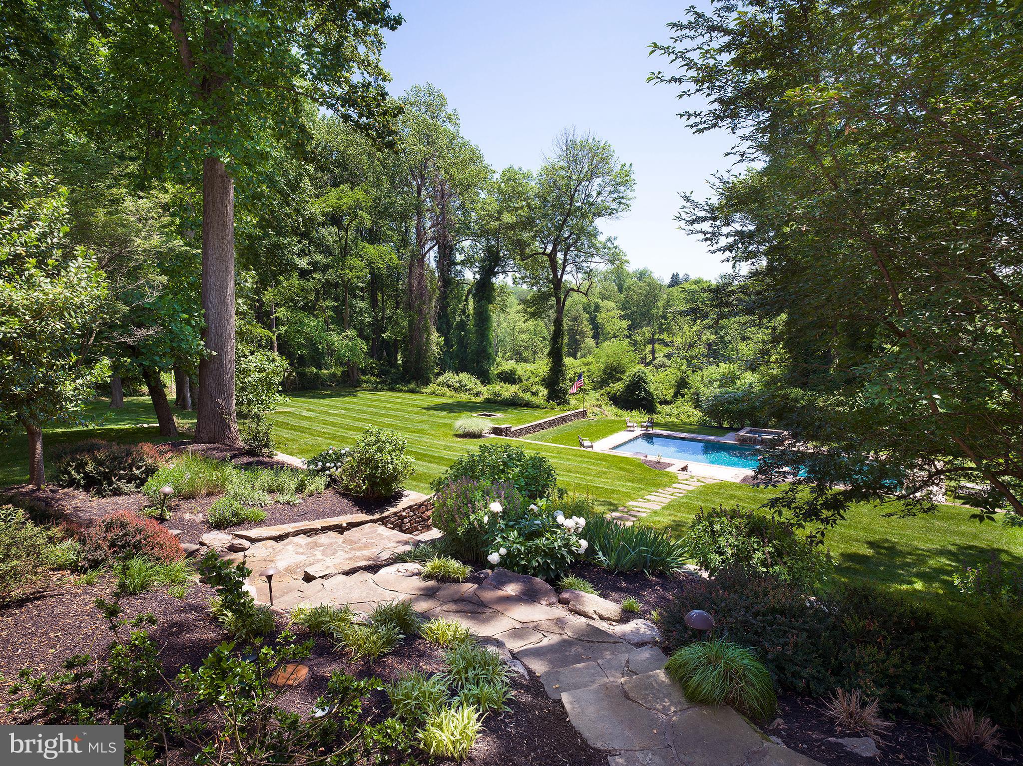 102 Springhouse Lane Newtown Square, PA 19073 - Photo 77 of 80 a view of a fire pit with large trees