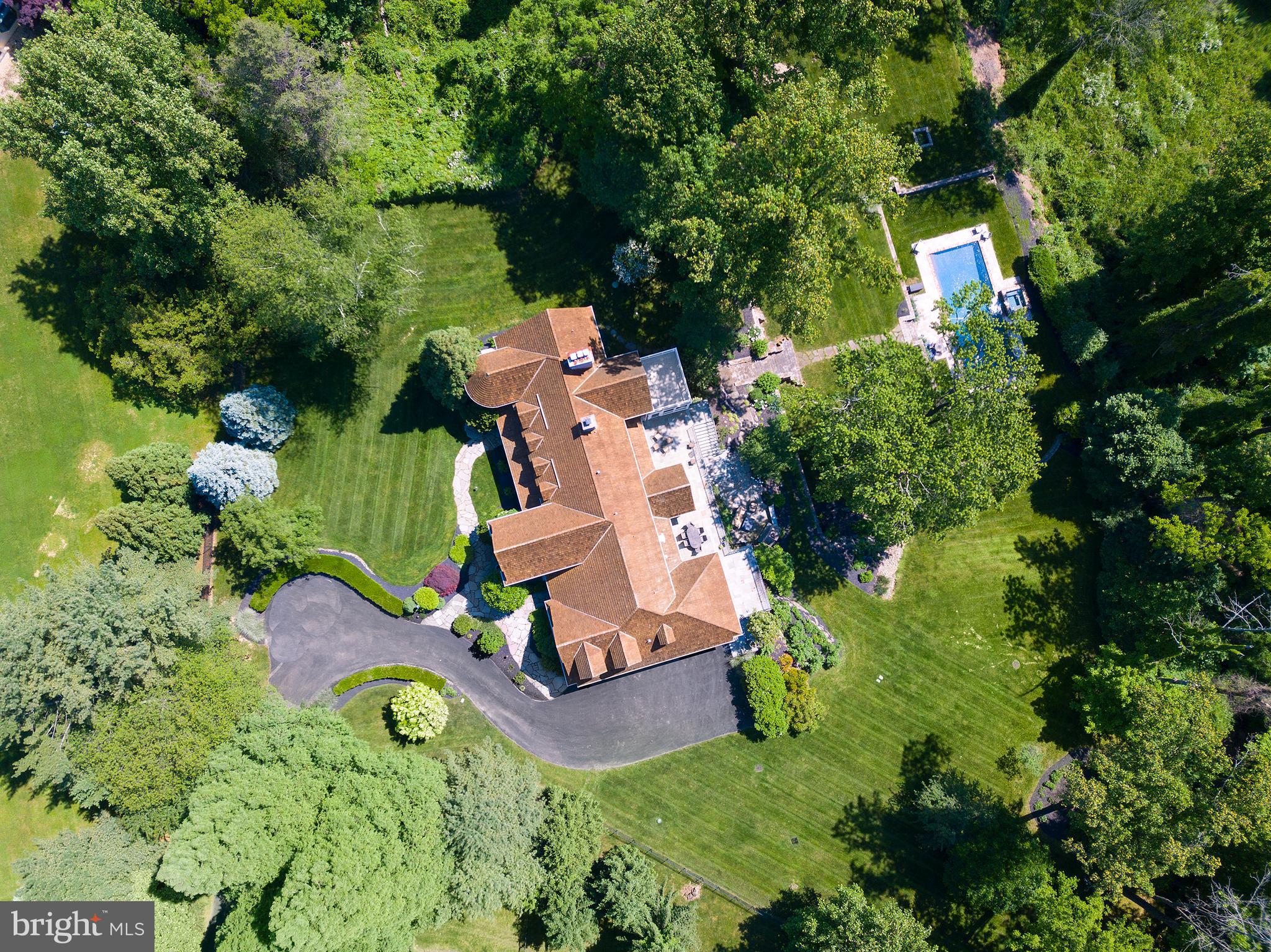 102 Springhouse Lane Newtown Square, PA 19073 - Photo 8 of 80 an aerial view of a house with a yard and large trees