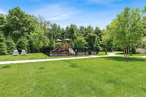 a view of a park with large trees